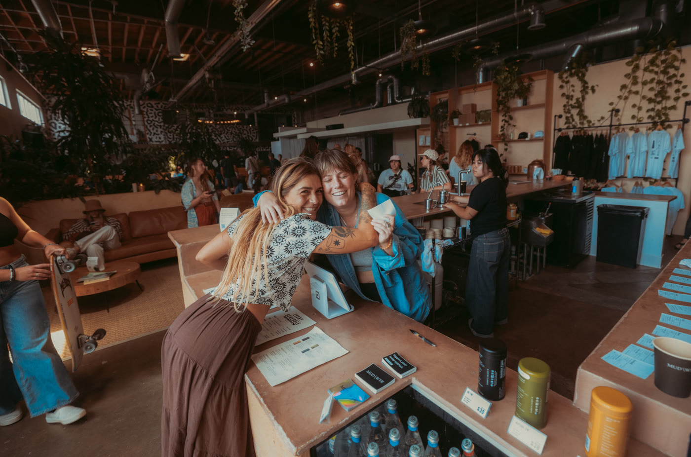 Two guests greeting each other at the counter